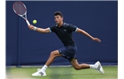 EASTBOURNE, ENGLAND - JUNE 14: Jathan Malik of Great Britain plays a forehand against Keelan Oakley of Great Britain during their Men's Singles first round qualifying match on day one of the Aegon International at Devonshire Park on June 14, 2014 in Eastbourne, England.  (Photo by Steve Bardens/Getty Images)